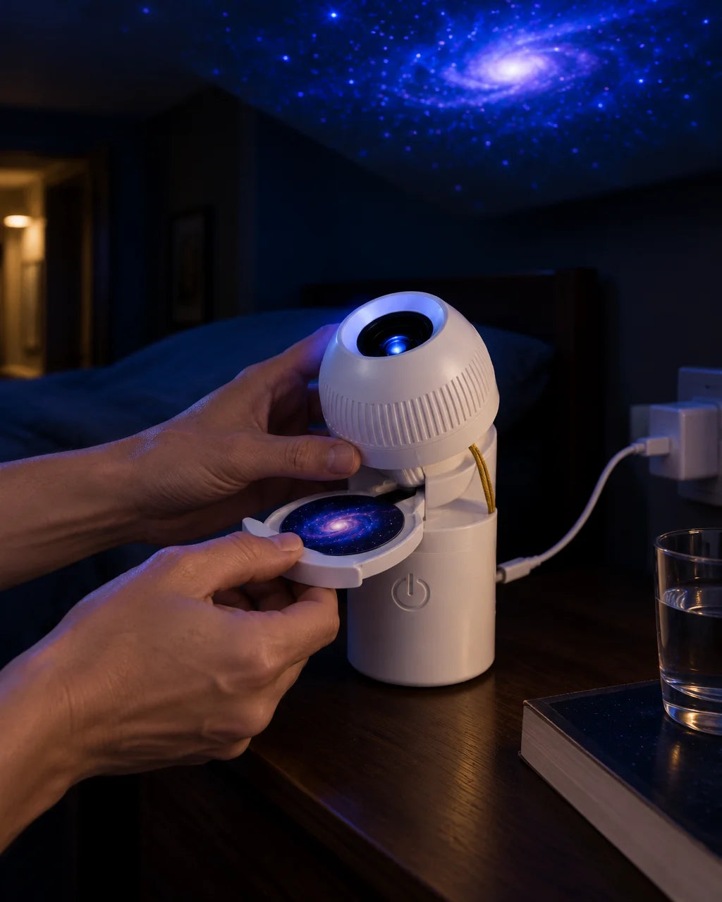 A portrait close-use photograph of the exact compact white USB galaxy projector from the reference a